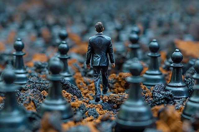 A man in a suit walks through a surreal landscape of oversized chess pawns on rocky terrain